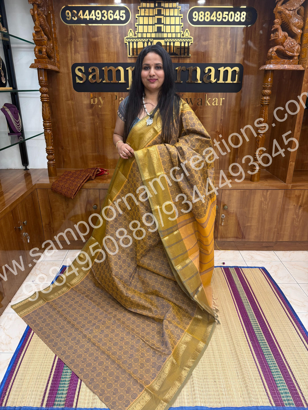 Ivory with Dusty Green , Rich Mayil and Chakram thread work in the body with Rettapet border , rich Pallu Pure Chettinad Cotton Saree