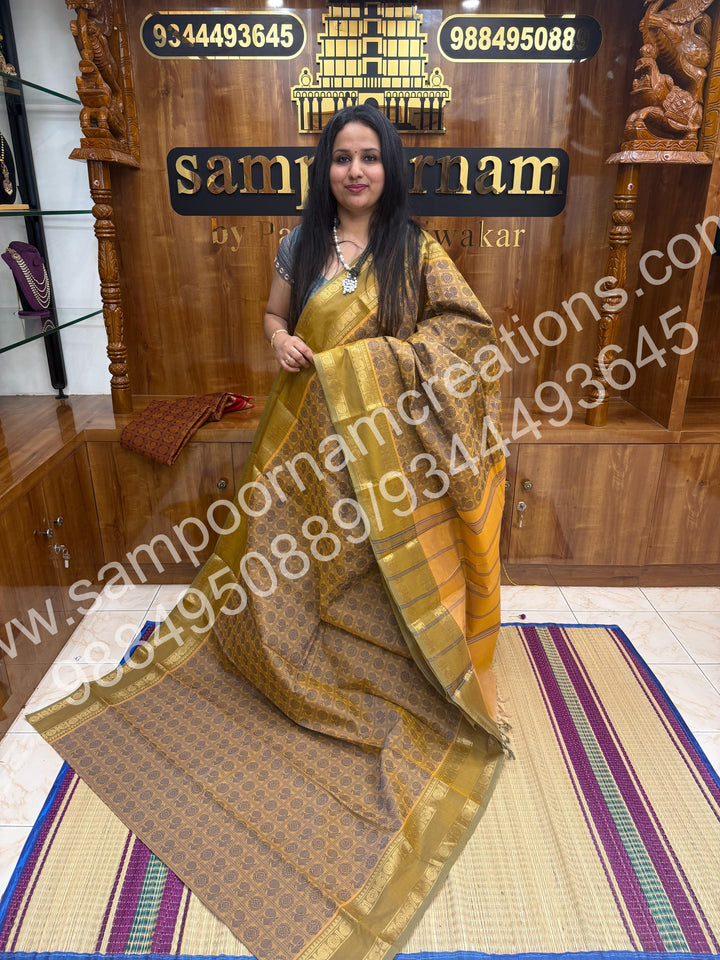 Ivory with Dusty Green , Rich Mayil and Chakram thread work in the body with Rettapet border , rich Pallu Pure Chettinad Cotton Saree