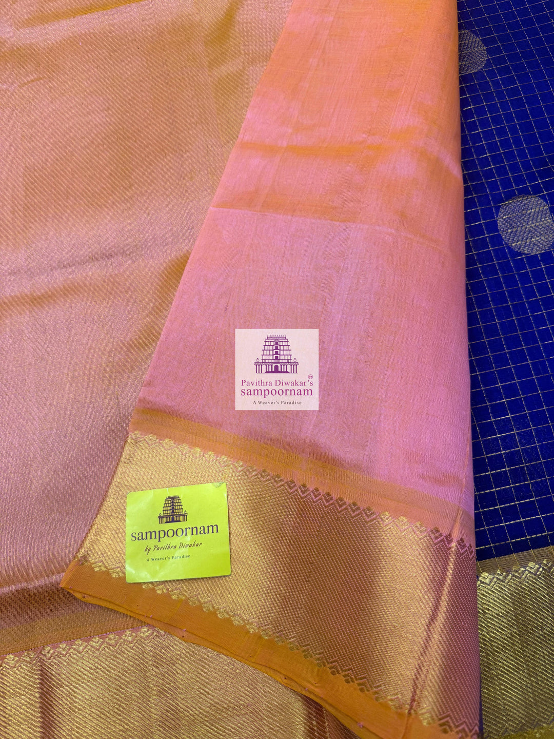 Blue with Baby Pink rich Zari checks in the body ,Mayil and Chakram rich butta in the body, traditional borders and rich Pallu Silk Cotton Saree