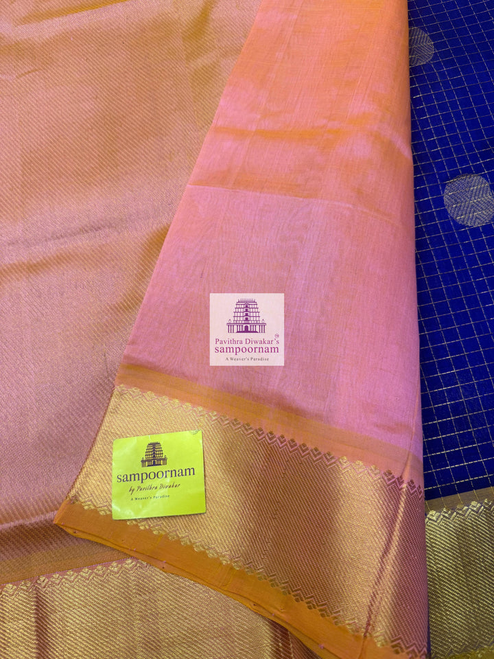 Blue with Baby Pink rich Zari checks in the body ,Mayil and Chakram rich butta in the body, traditional borders and rich Pallu Silk Cotton Saree