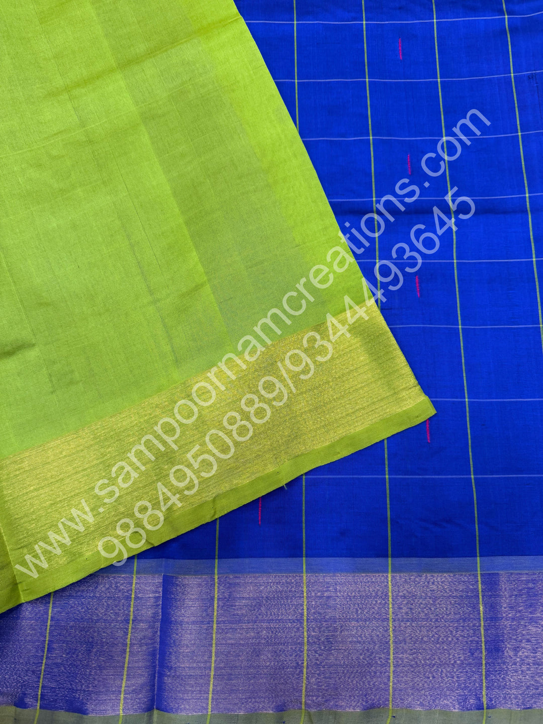 Royal Blue with Green , Checks in the body with  rain drop thread butta in the body and Pallu Semi Silk Cotton Saree