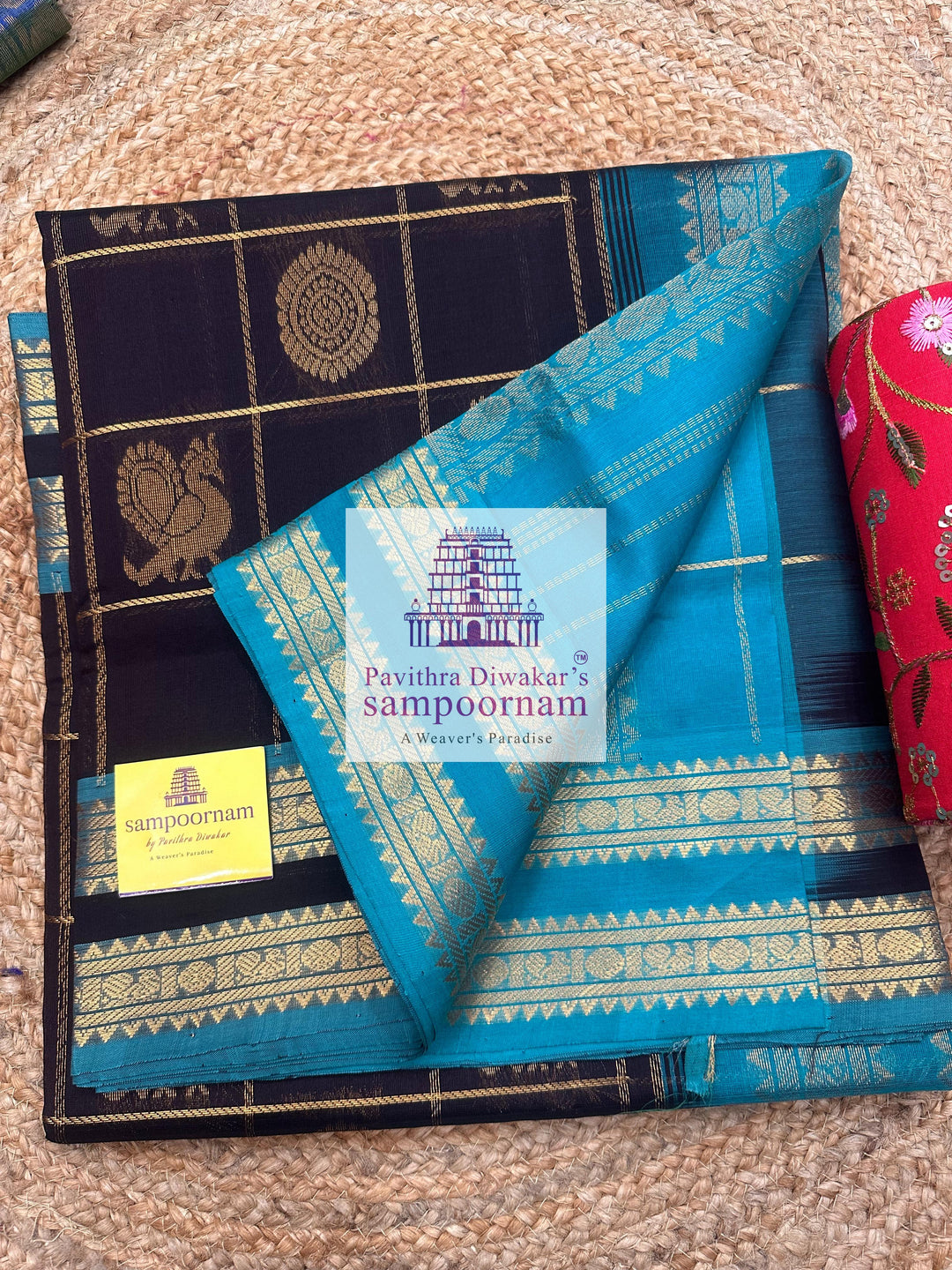 Black with Turquoise Blue , rich Zari checks in the body , Mayil and Chakram rich butta in the body , rettapet  borders and rich Pallu Silk Cotton Saree