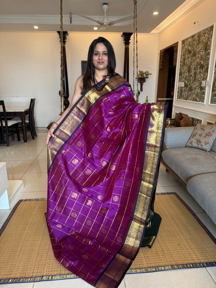 Purple with Green , Zari Kattam in the body with mayil and Chakram butta , traditional borders and rich Pallu , silk cotton saree
