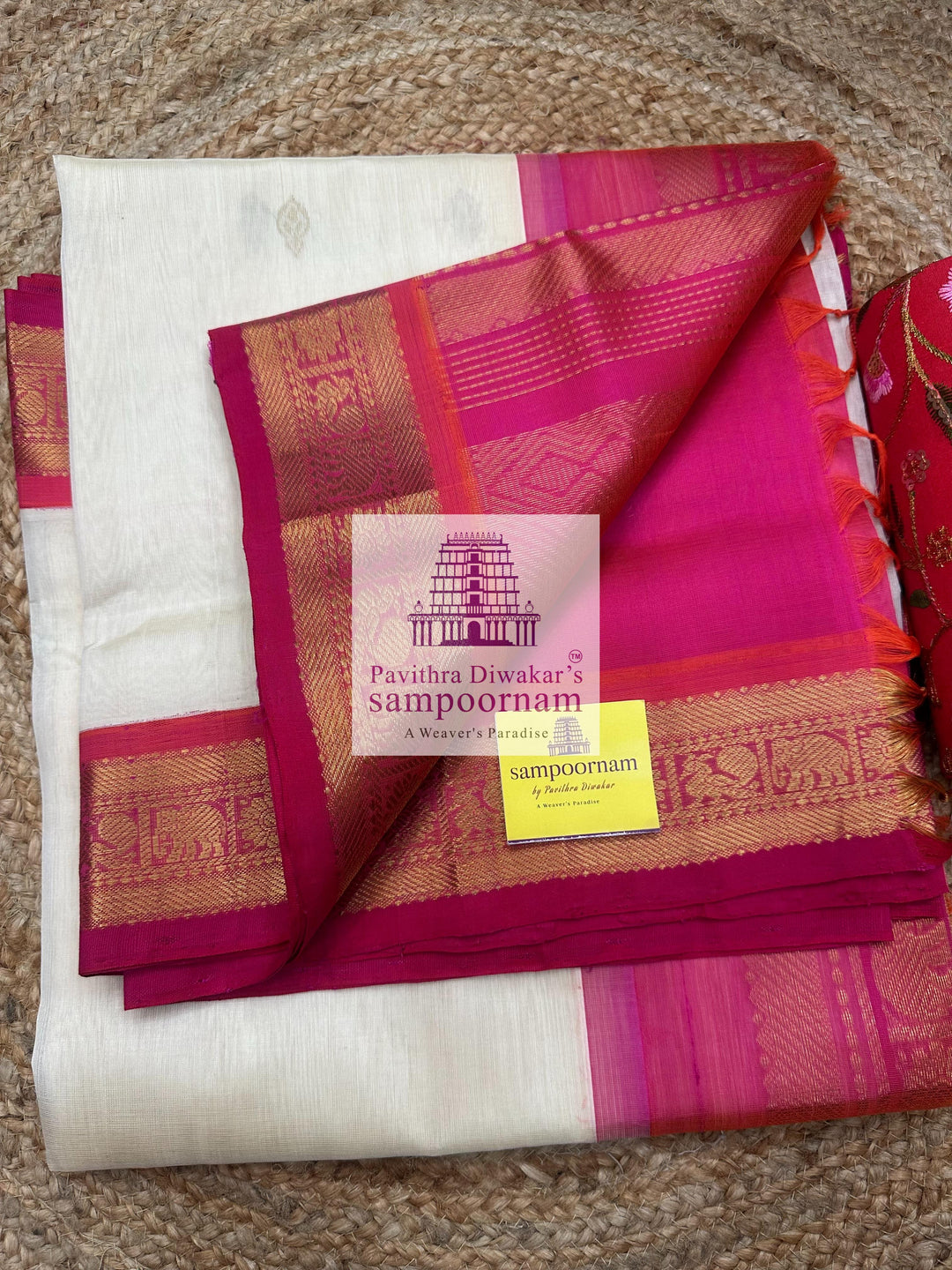 Halfwhite with Pink , Zari butta in the body ,traditional borders and rich Pallu Korvai Silk Cotton Saree