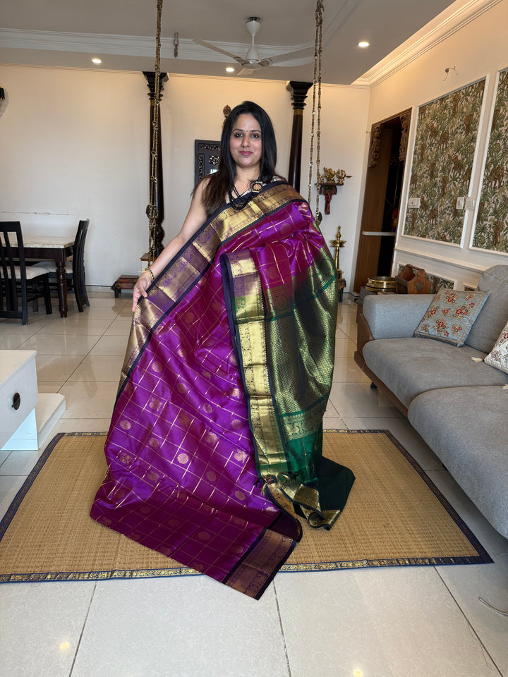 Purple with Green , Zari Kattam in the body with mayil and Chakram butta , traditional borders and rich Pallu , silk cotton saree