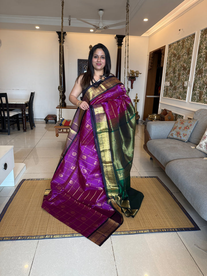 Purple with Green , Zari Kattam in the body with mayil and Chakram butta , traditional borders and rich Pallu , silk cotton saree