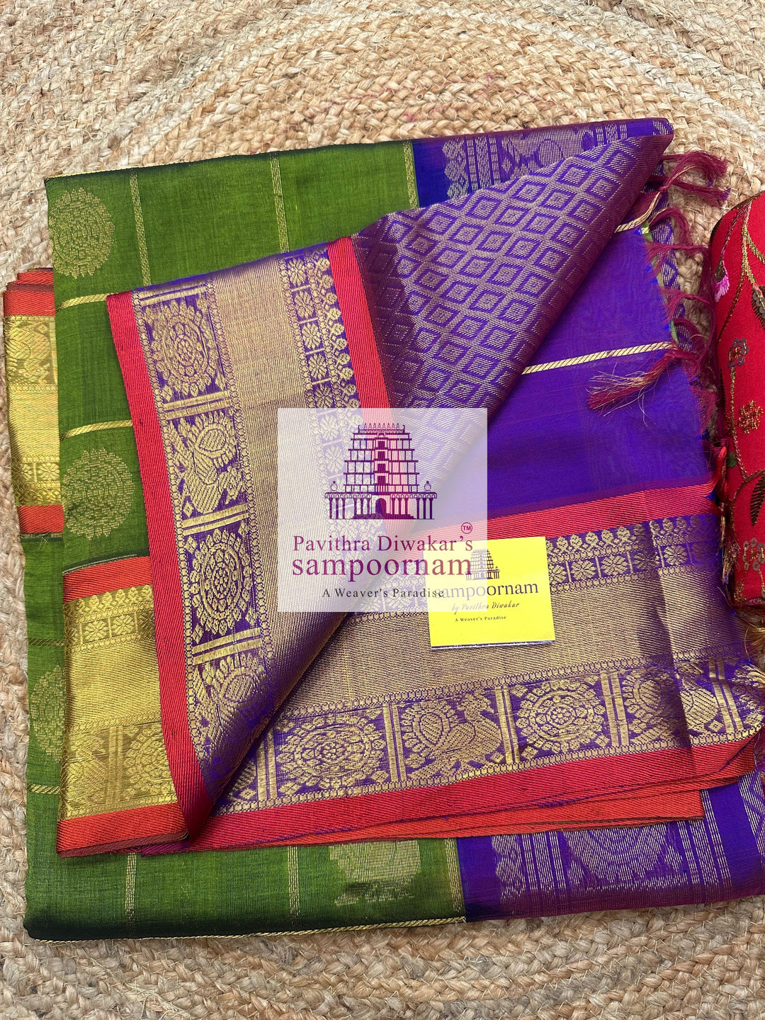 Green with Purple , Red Selvedge , rich Zari checks in the body , Mayil and Chakram rich butta in the body , traditional borders and rich Pallu Silk Cotton Saree
