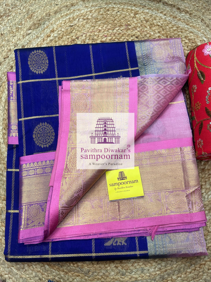 Blue with Baby Pink  , rich Zari checks in the body , Mayil and Chakram rich butta in the body , traditional borders and rich Pallu Silk Cotton Saree