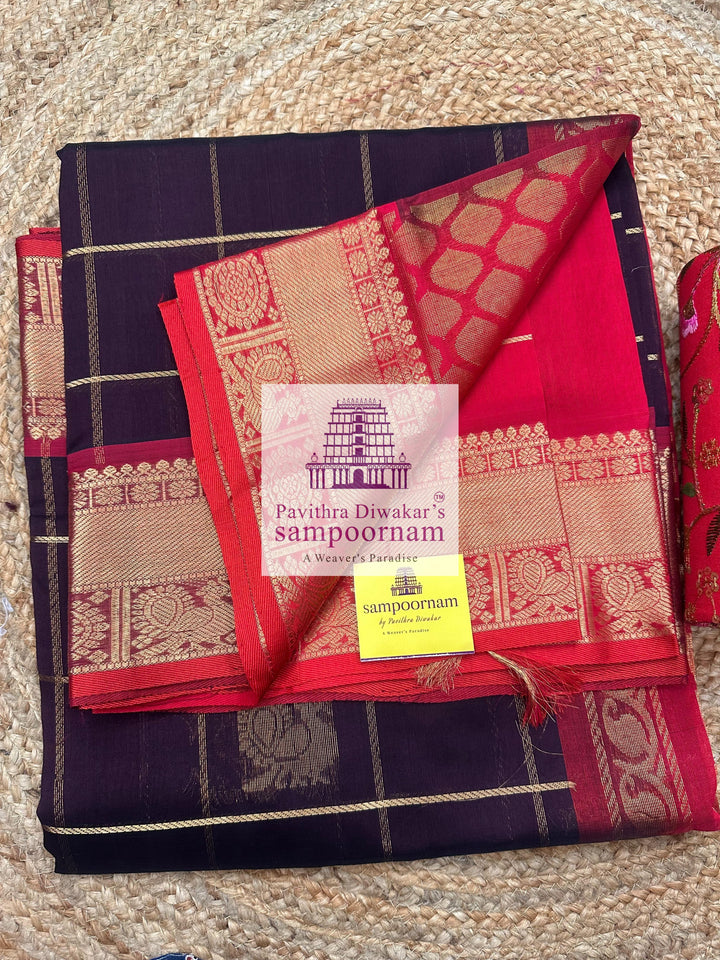 Brown with Red , rich Zari checks in the body , Mayil and Chakram rich butta in the body , traditional borders and rich Pallu Silk Cotton Saree