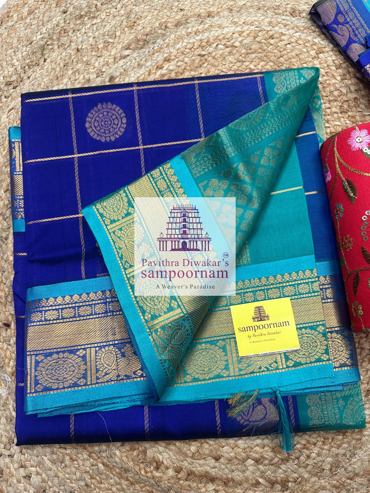 Dark Blue with Turquoise Blue  , rich Zari checks in the body , Mayil and Chakram rich butta in the body , traditional borders and rich Pallu Silk Cotton Saree