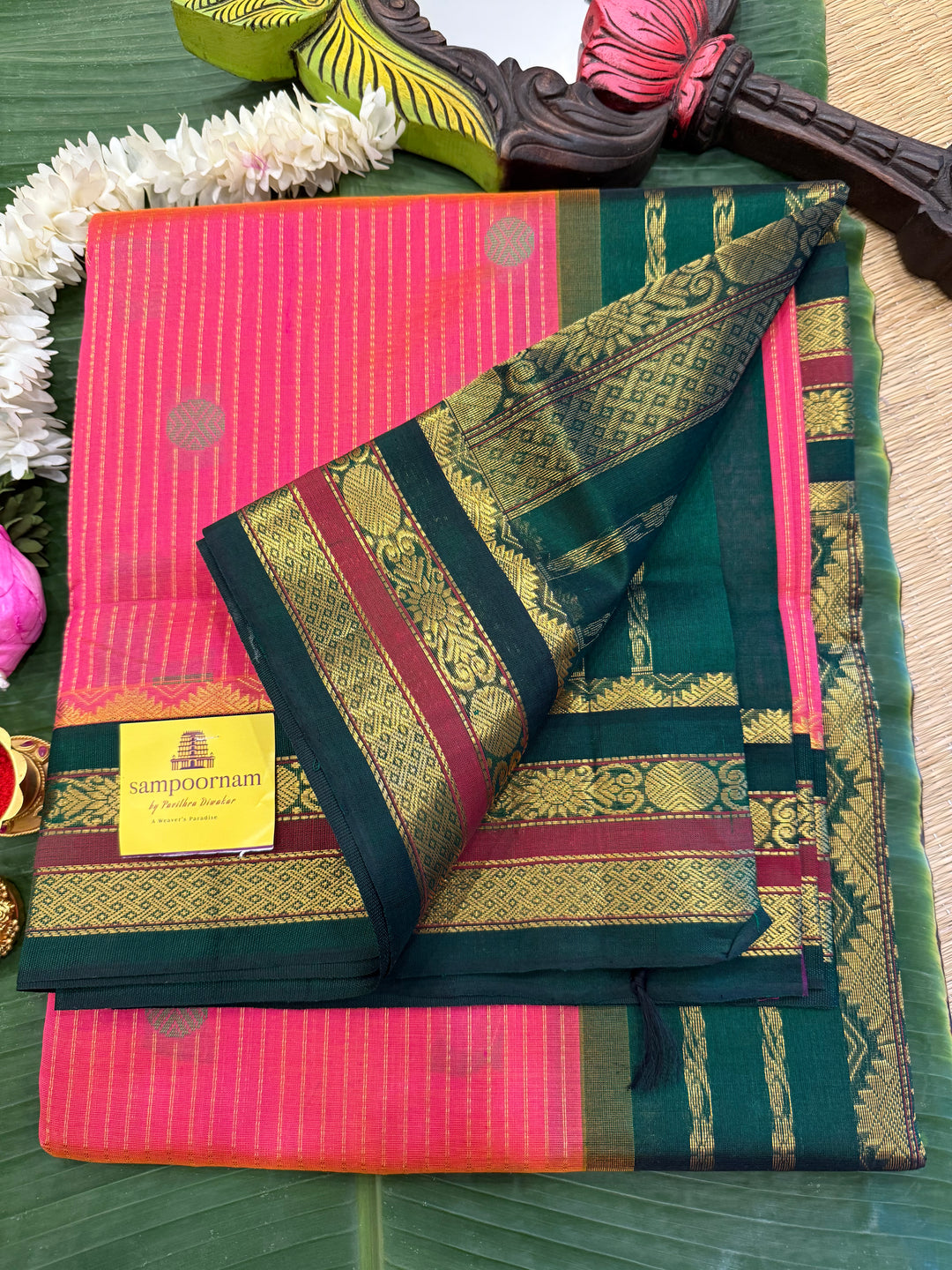 Magenta with Green , rich zari butta and vertical zari lines in the body, traditional borders  and rich Pallu Korvai Silk Cotton Saree