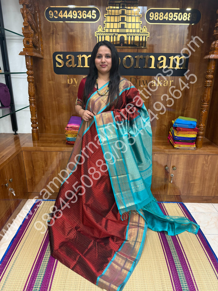 Dark Maroon  with Turquoise Blue , Rich Traditional Borders and Lakshadeepam Zari Butta all over the body and Grand Pallu , Pure Silk Cotton Saree