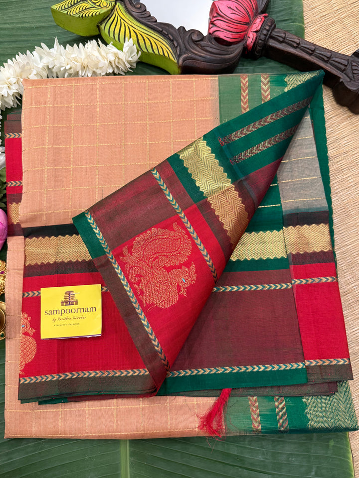 Biscuit colour with Red and Green , rich zari checks in the body , Annam butta in one side border  and grand Pallu Korvai Silk Cotton Saree