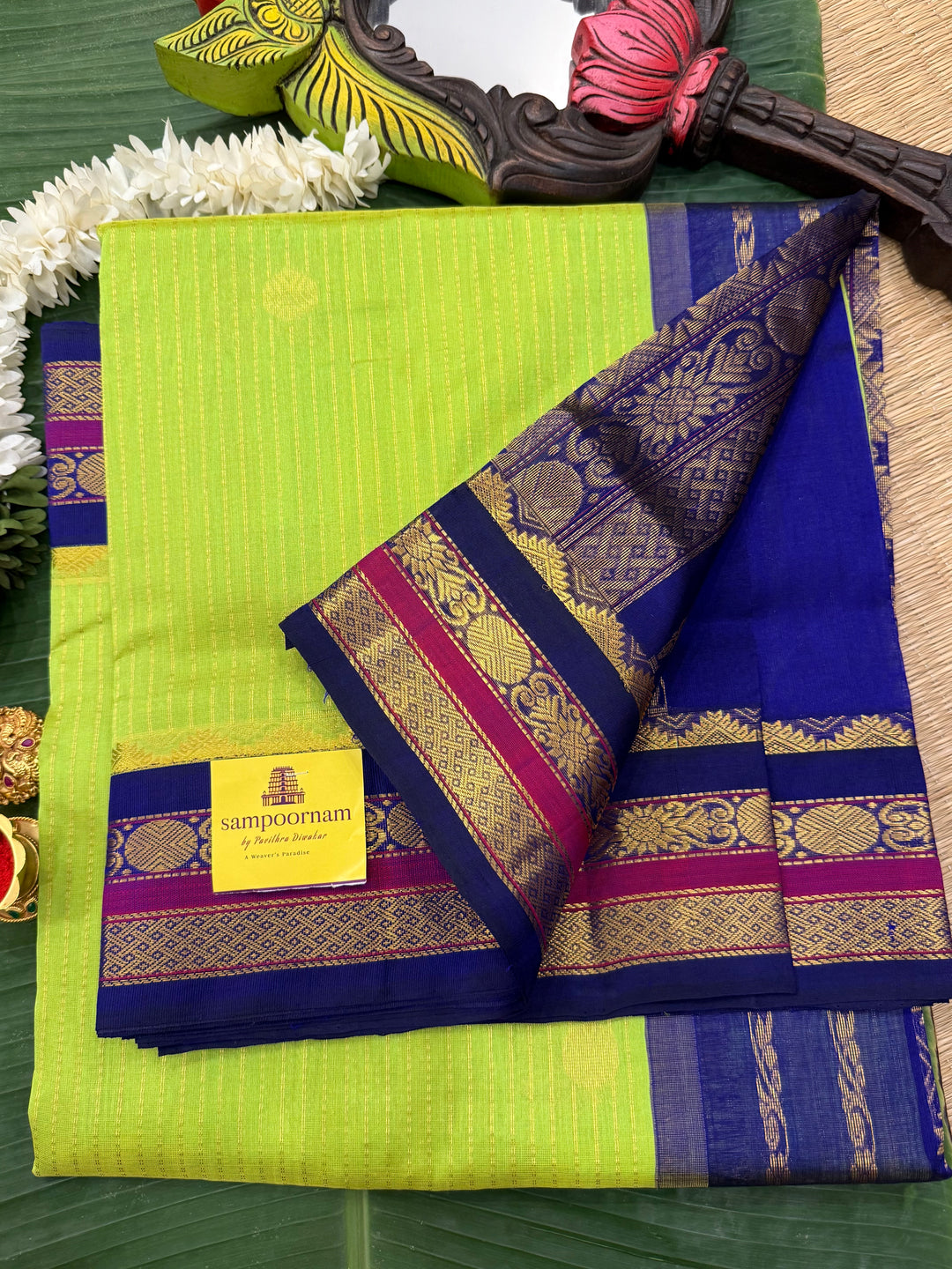 Fluorescent Green with Blue, rich zari butta and vertical zari lines in the body, traditional borders  and rich Pallu Korvai Silk Cotton Saree