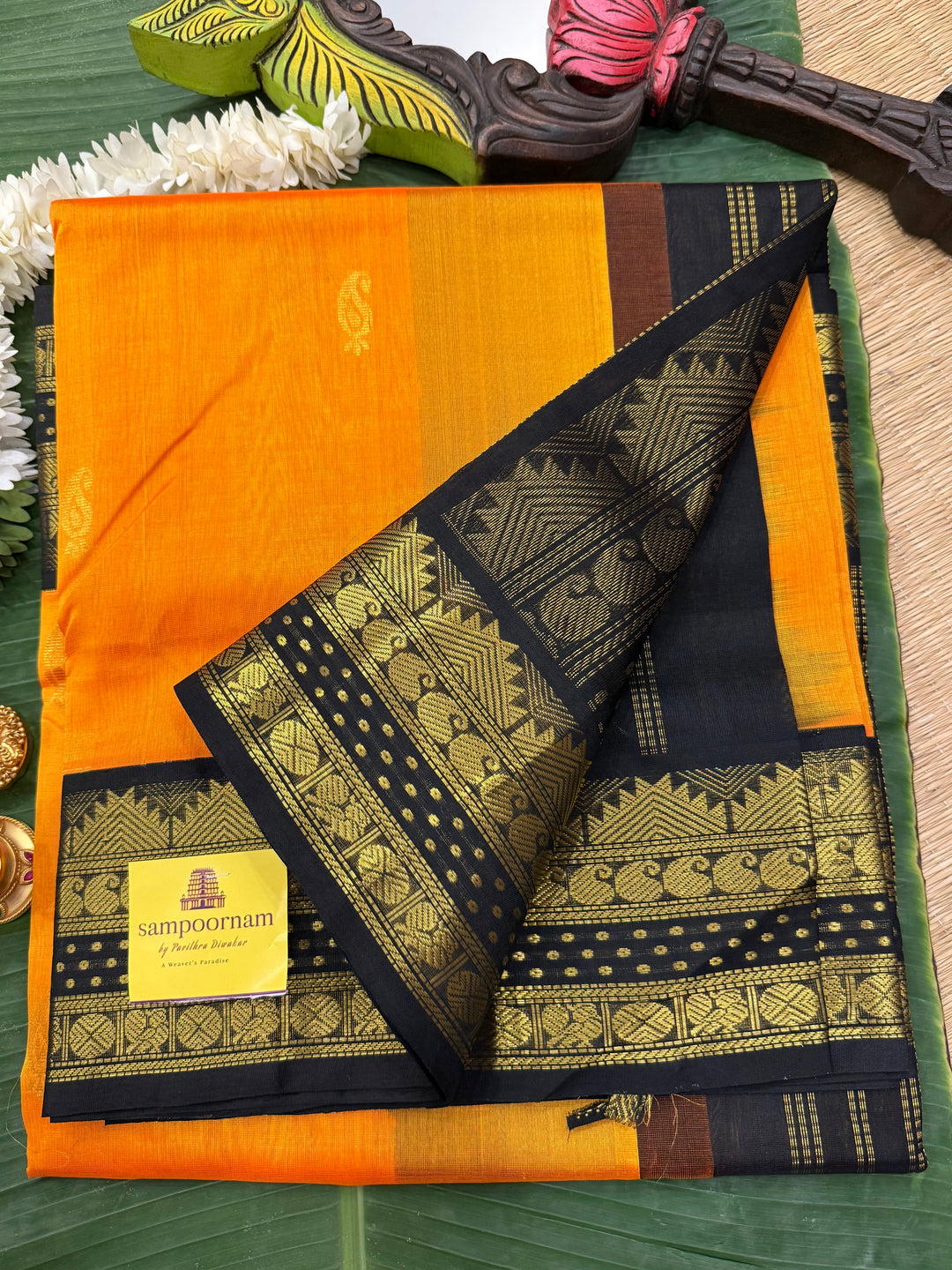 Mambazha Manjal with Black Lakshadeepam traditional borders ,zari butta in the body  and grand Pallu Korvai Silk Cotton Saree