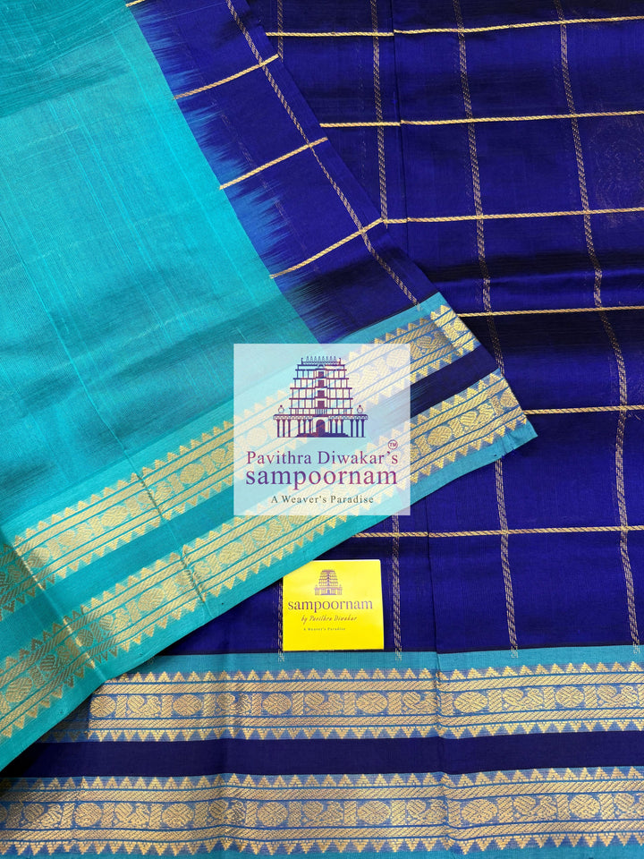 Dark Blue with Blue  , rich Zari checks in the body , Mayil and Chakram rich butta in the body , rettapet borders and rich Pallu Silk Cotton Saree