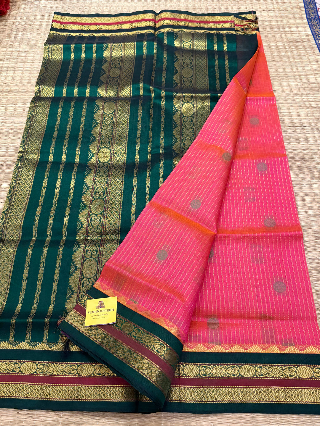 Magenta with Green , rich zari butta and vertical zari lines in the body, traditional borders  and rich Pallu Korvai Silk Cotton Saree