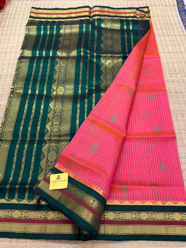 Magenta with Green , rich zari butta and vertical zari lines in the body, traditional borders  and rich Pallu Korvai Silk Cotton Saree