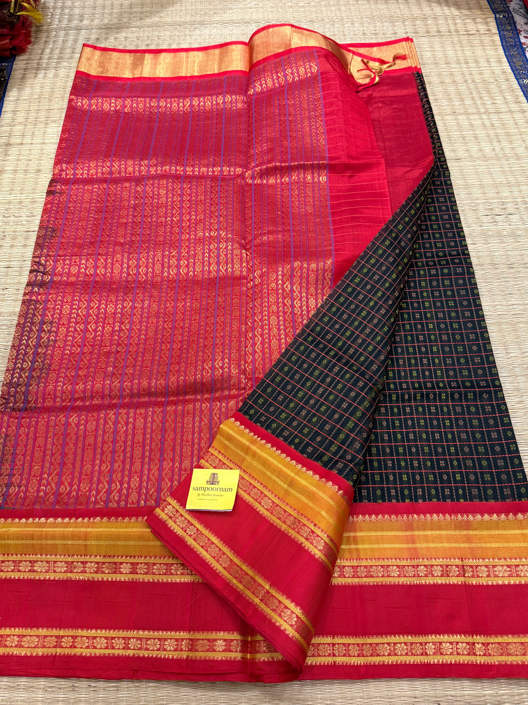 Black with red Lakshadeepam thread butta in the body , rettapet border and rich Pallu Korvai Silk Cotton Saree