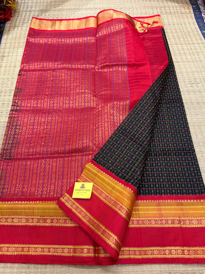 Black with red Lakshadeepam thread butta in the body , rettapet border and rich Pallu Korvai Silk Cotton Saree