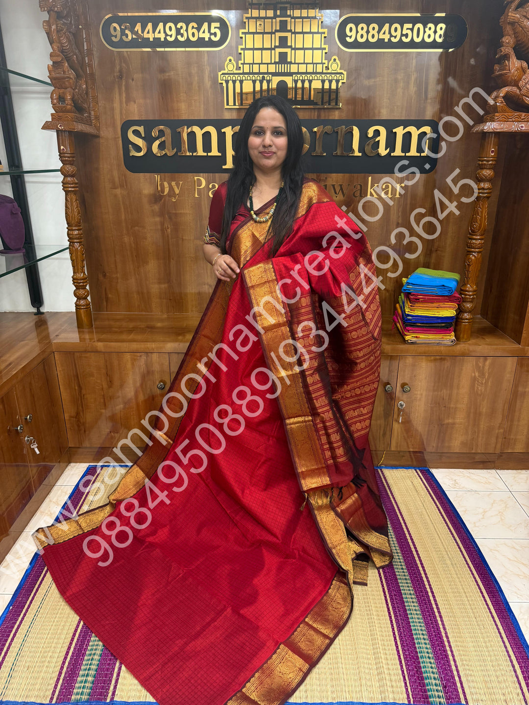 Red with Dark Maroon  , Rich Traditional Borders and Lakshadeepam Thread  Butta all over the body and Grand Pallu , Pure Silk Cotton Saree