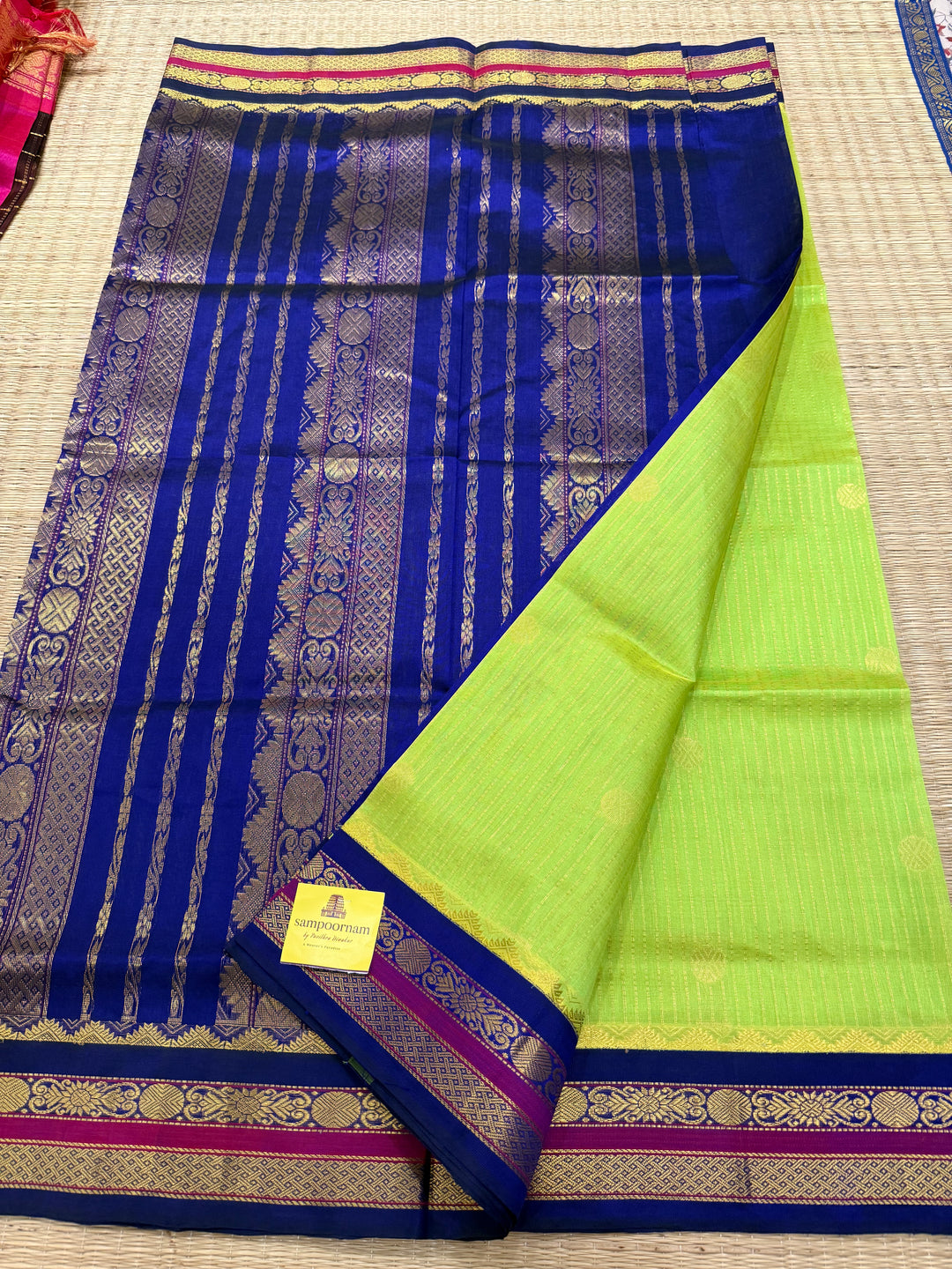 Fluorescent Green with Blue, rich zari butta and vertical zari lines in the body, traditional borders  and rich Pallu Korvai Silk Cotton Saree