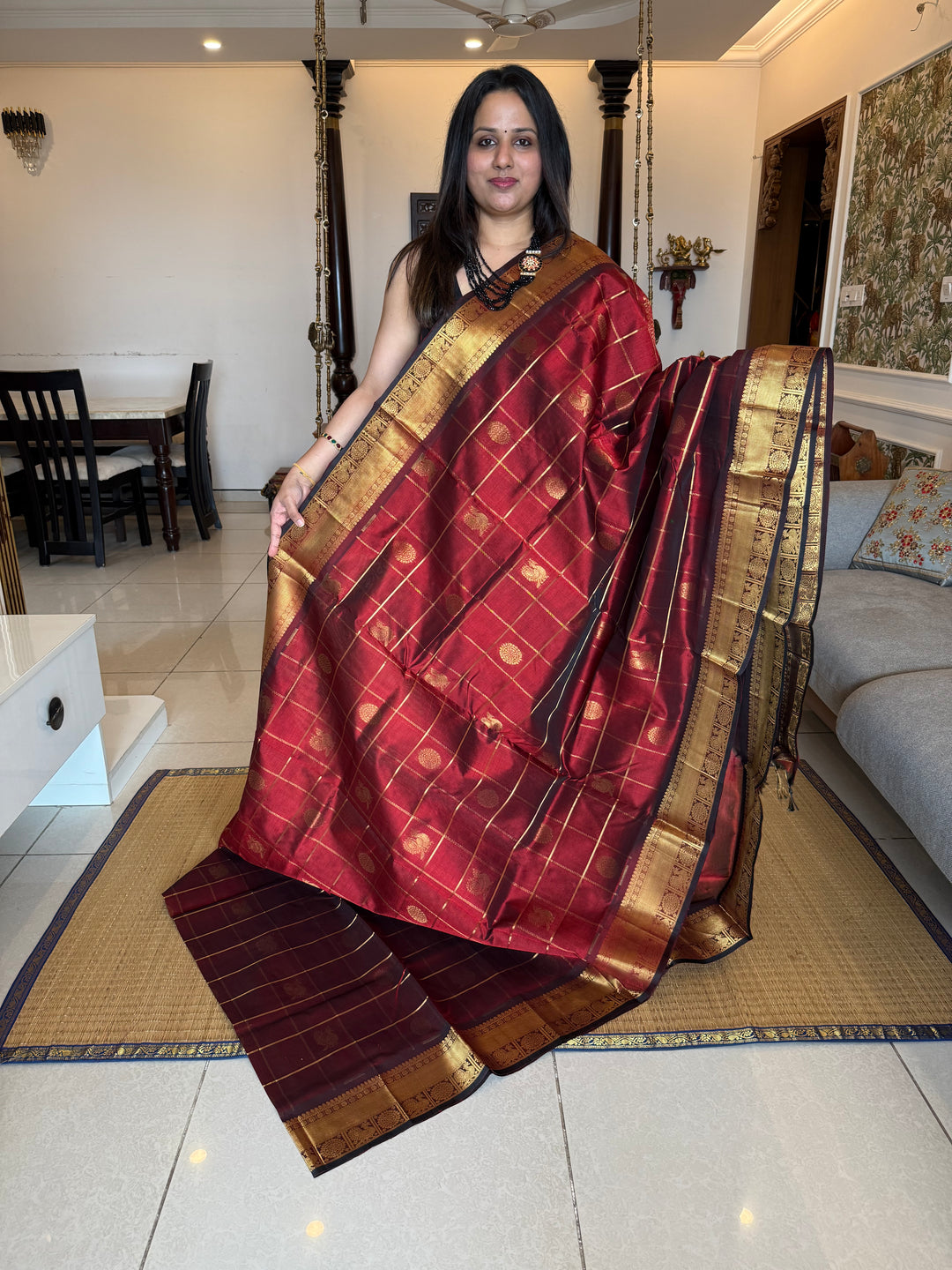 Maroon , Zari Kattam in the body with mayil and Chakram butta , traditional borders and rich Pallu , silk cotton saree