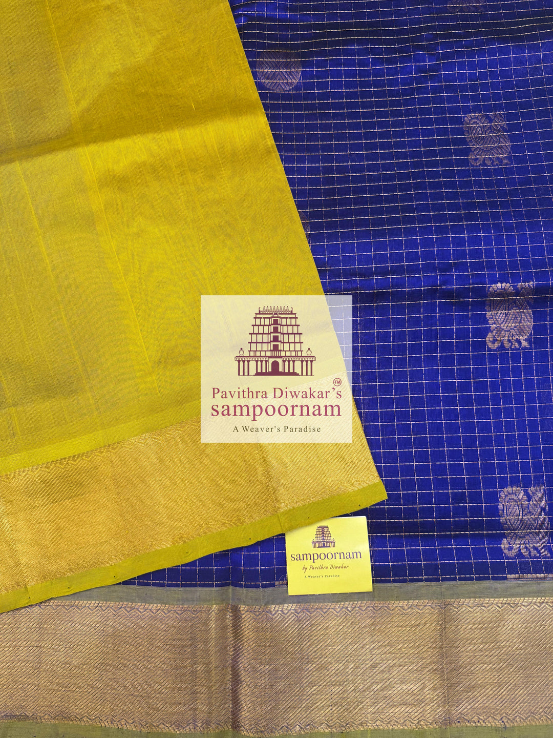 Blue with Lemon Yellow , rich Zari checks in the body , Mayil and Chakram rich butta in the body , traditional borders and rich Pallu Silk Cotton Saree