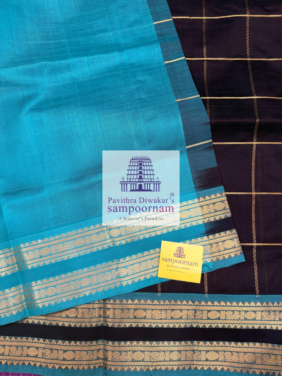 Black with Turquoise Blue , rich Zari checks in the body , Mayil and Chakram rich butta in the body , rettapet  borders and rich Pallu Silk Cotton Saree