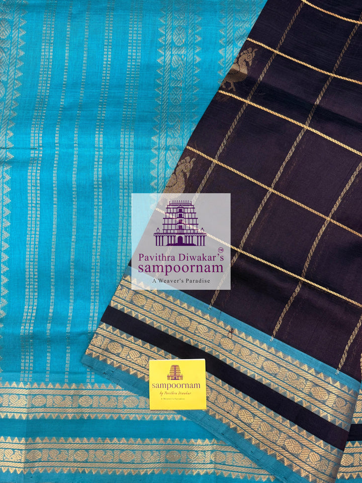Black with Turquoise Blue , rich Zari checks in the body , Mayil and Chakram rich butta in the body , rettapet  borders and rich Pallu Silk Cotton Saree
