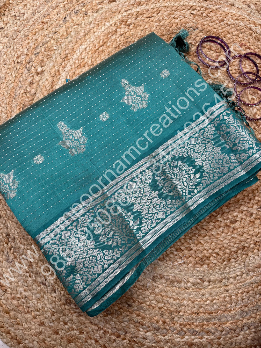 Mint Green , Silver Floral buttas in the body with Silver Zari Border , Tissue Pallu and Tissue Blouse  , Semi Tussar Saree