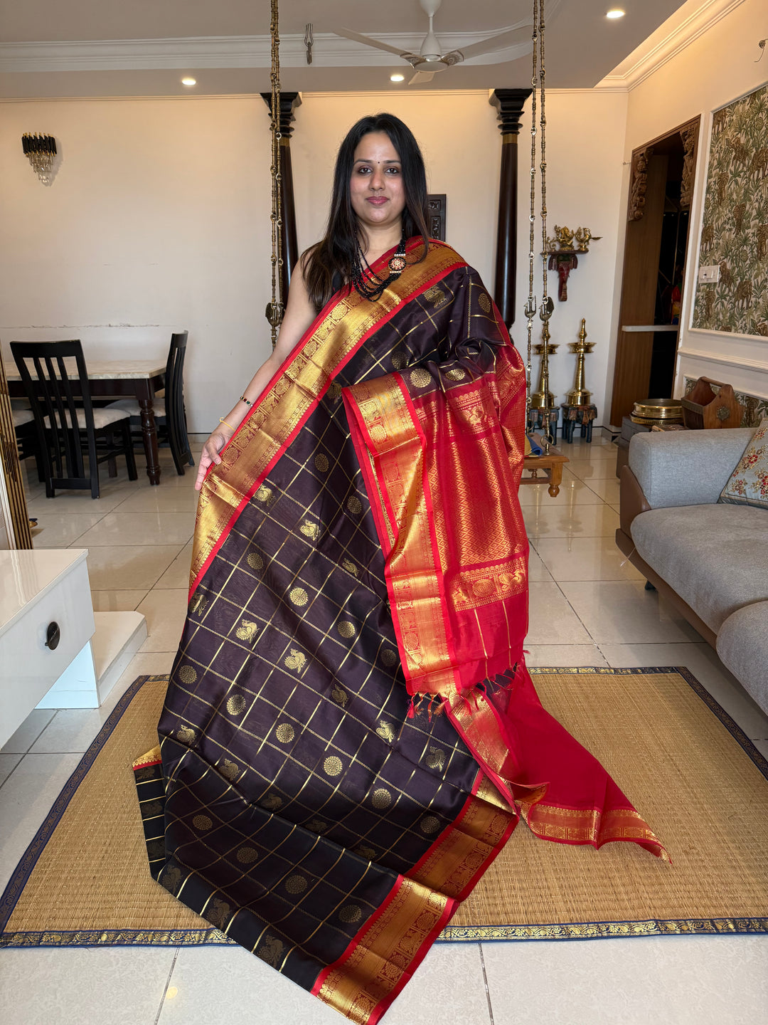 Brown with Red , Zari Kattam with mayil and Chakram rich butta in the body , traditional borders and rich Pallu silk cotton saree