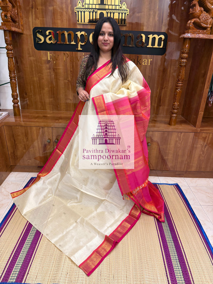 Halfwhite with Pink , Zari butta in the body ,traditional borders and rich Pallu Korvai Silk Cotton Saree