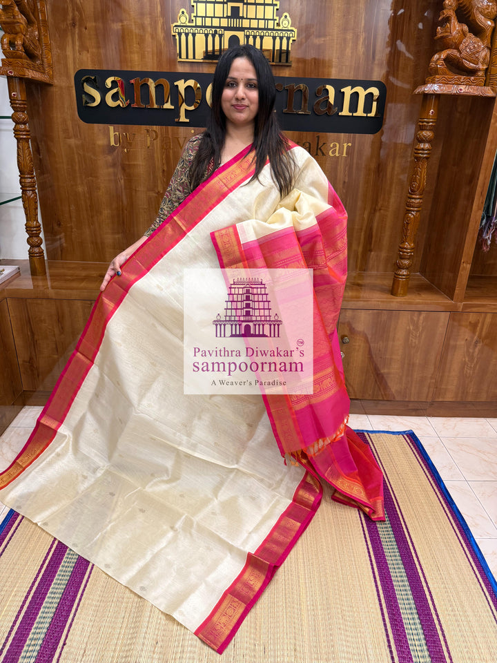 Halfwhite with Pink , Zari butta in the body ,traditional borders and rich Pallu Korvai Silk Cotton Saree