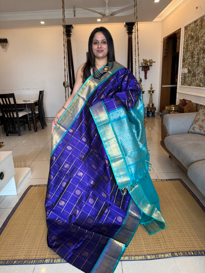 Offwhite with Black,  Zari checks in the body , rettapet traditional borders and rich Pallu Korvai Silk Cotton Saree