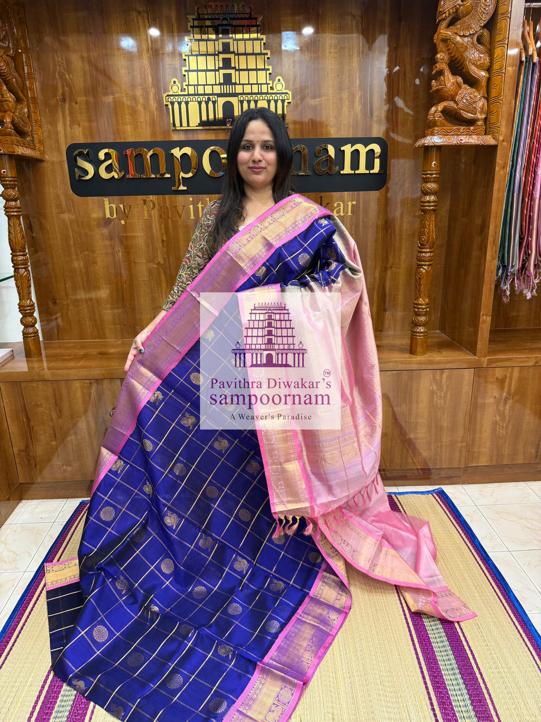 Blue with Baby Pink  , rich Zari checks in the body , Mayil and Chakram rich butta in the body , traditional borders and rich Pallu Silk Cotton Saree