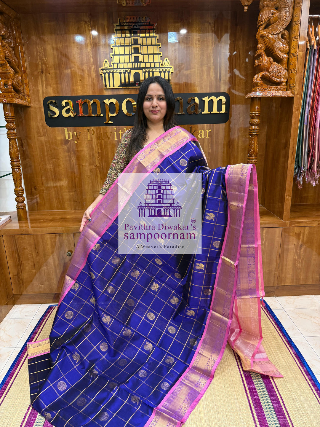Blue with Baby Pink  , rich Zari checks in the body , Mayil and Chakram rich butta in the body , traditional borders and rich Pallu Silk Cotton Saree