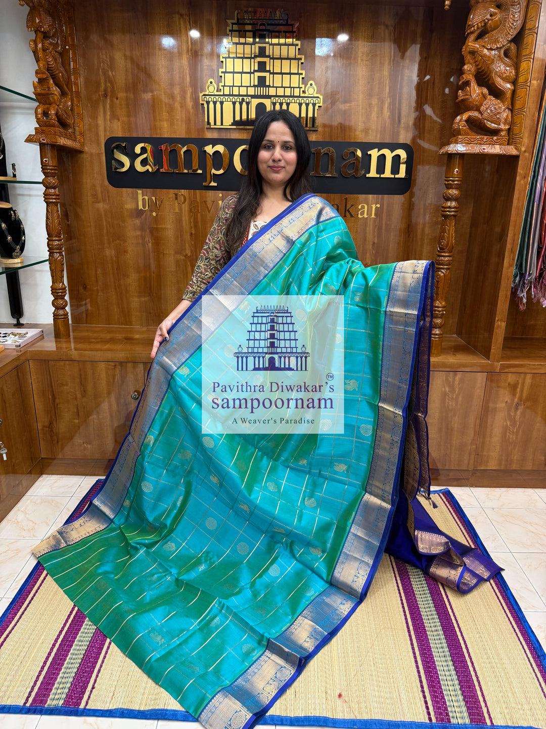 Ramar Green with Blue  , rich Zari checks in the body , Mayil and Chakram rich butta in the body , traditional borders and rich Pallu Silk Cotton Saree