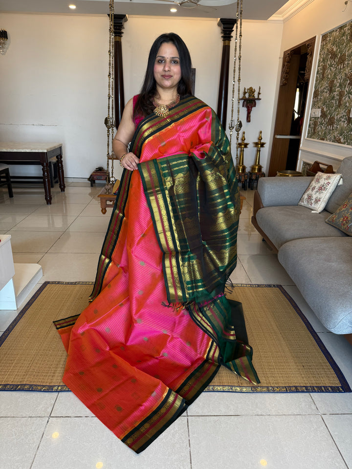 Magenta with Green , rich zari butta and vertical zari lines in the body, traditional borders  and rich Pallu Korvai Silk Cotton Saree