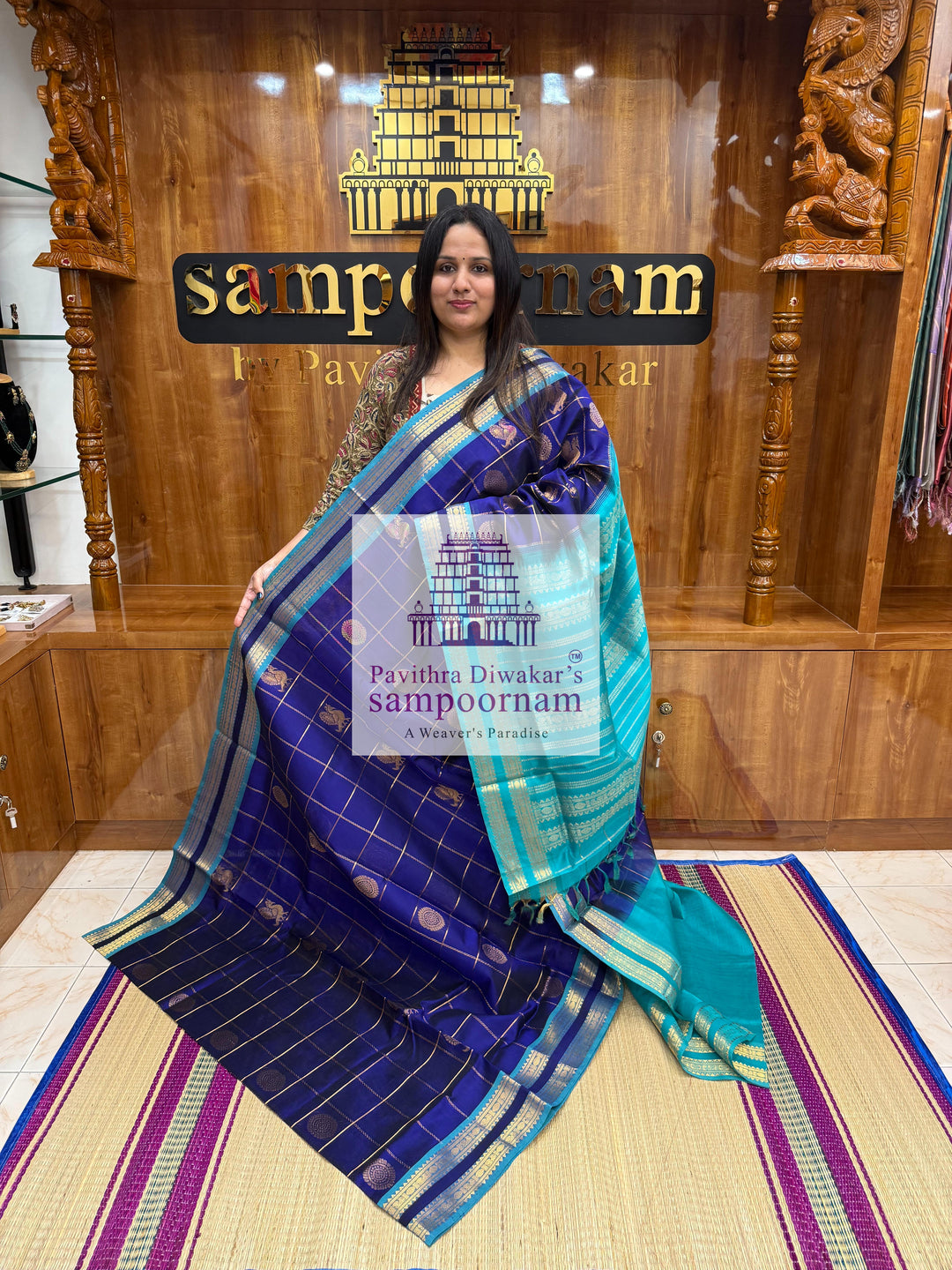 Dark Blue with Blue  , rich Zari checks in the body , Mayil and Chakram rich butta in the body , rettapet borders and rich Pallu Silk Cotton Saree