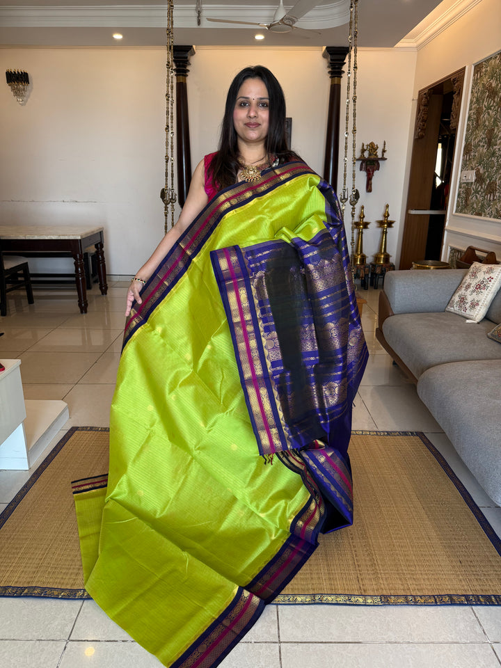 Fluorescent Green with Blue, rich zari butta and vertical zari lines in the body, traditional borders  and rich Pallu Korvai Silk Cotton Saree