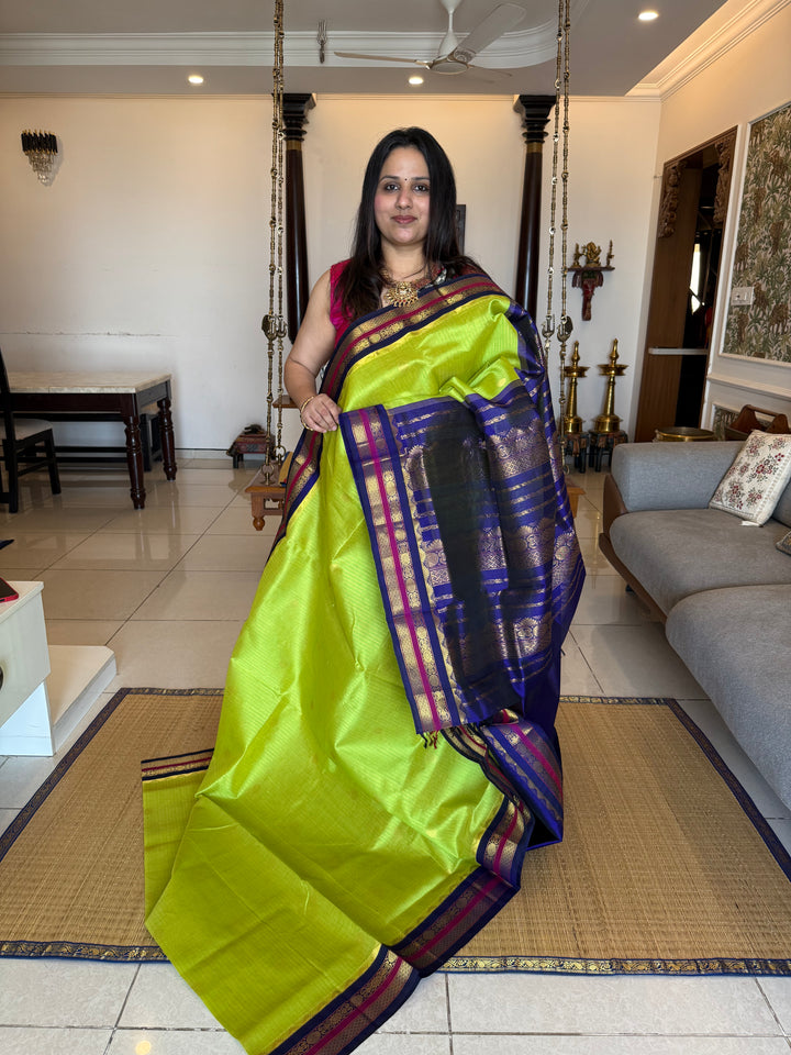 Fluorescent Green with Blue, rich zari butta and vertical zari lines in the body, traditional borders  and rich Pallu Korvai Silk Cotton Saree