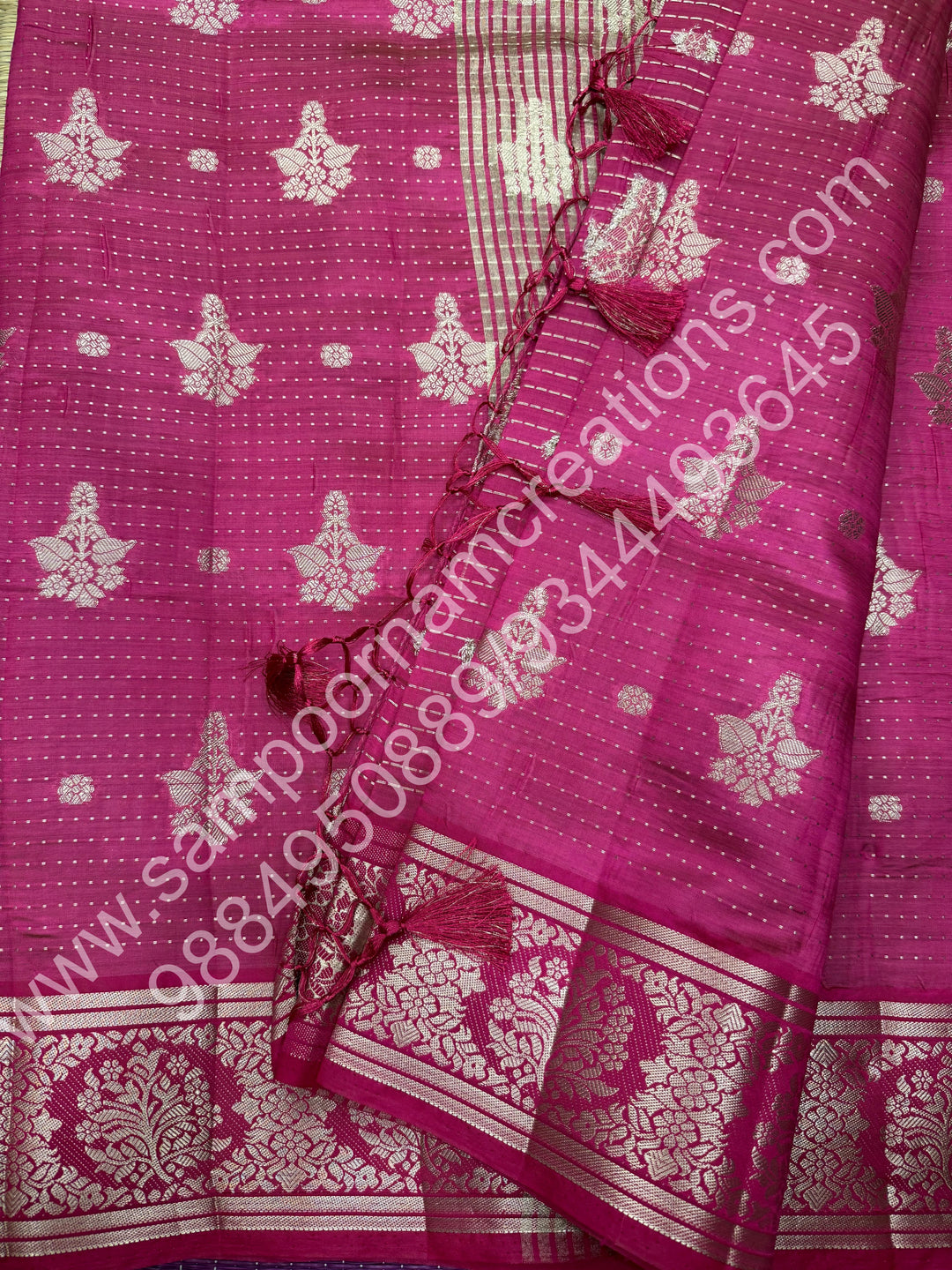 Rani Pink , Silver Floral buttas in the body with Silver Zari Border , Tissue Pallu and Tissue Blouse  , Semi Tussar Saree