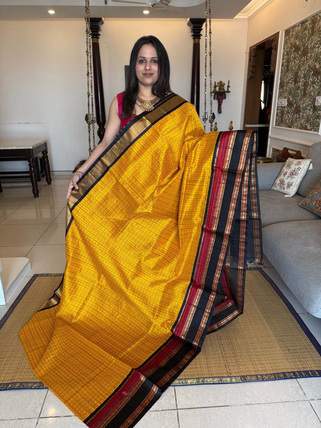 Manjal with Black , Lakshadeepam thread butta in the body , rettapet border and rich Pallu Korvai Silk Cotton Saree