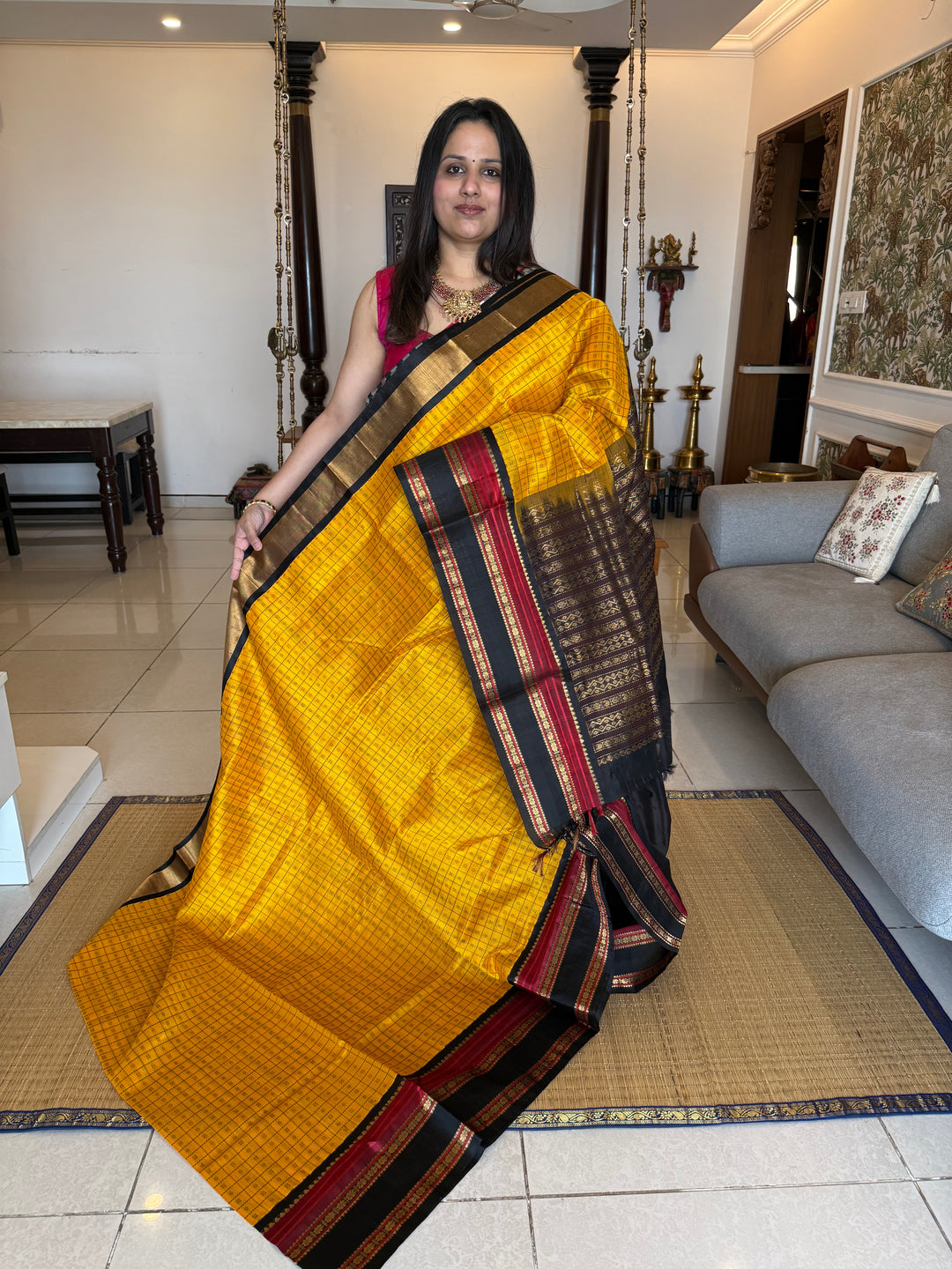 Manjal with Black , Lakshadeepam thread butta in the body , rettapet border and rich Pallu Korvai Silk Cotton Saree