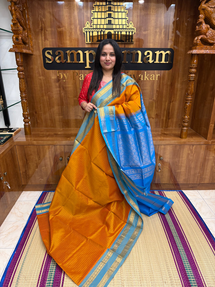 Orange with Blue , Zari Kattam in the Body, Traditional Rettapet Borders and Rich Pallu Semi Silk Cotton Saree