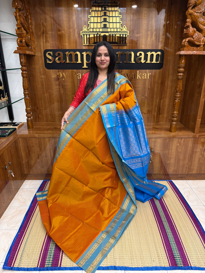 Orange with Blue , Zari Kattam in the Body, Traditional Rettapet Borders and Rich Pallu Semi Silk Cotton Saree