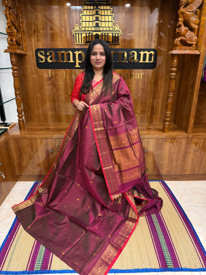 Dark magenta with Red Selvedge, Zari Kattam in the Body with Rich Butta, Traditional Borders and Rich Pallu Semi Silk Cotton Saree