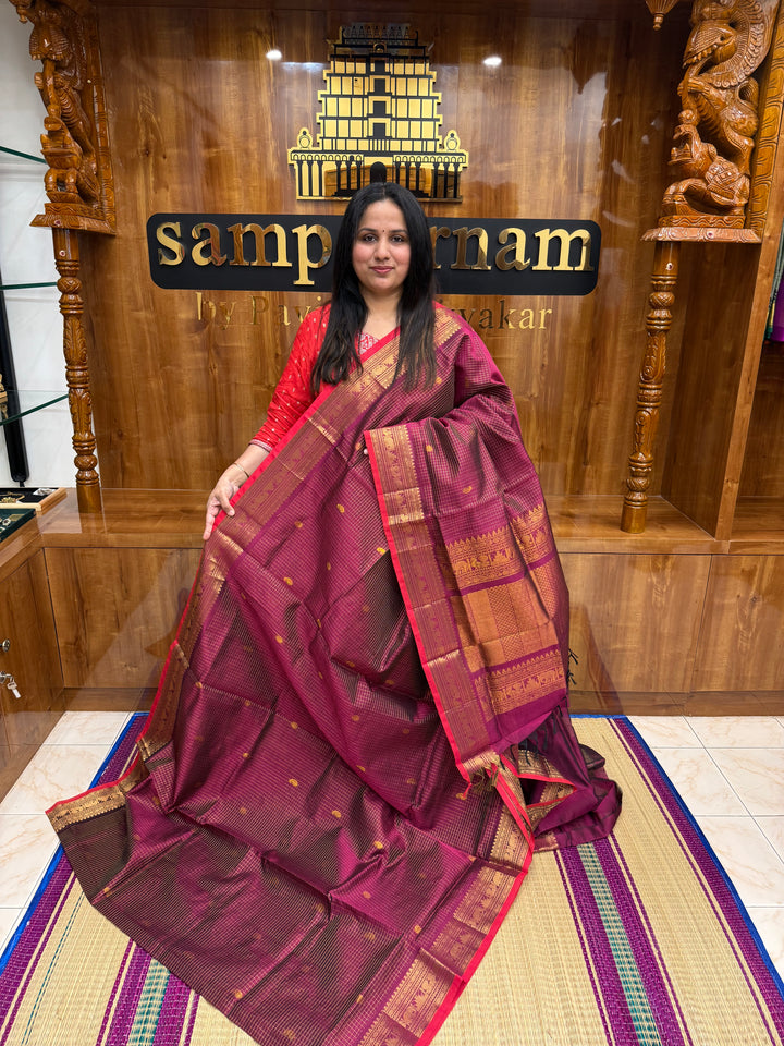 Dark magenta with Red Selvedge, Zari Kattam in the Body with Rich Butta, Traditional Borders and Rich Pallu Semi Silk Cotton Saree