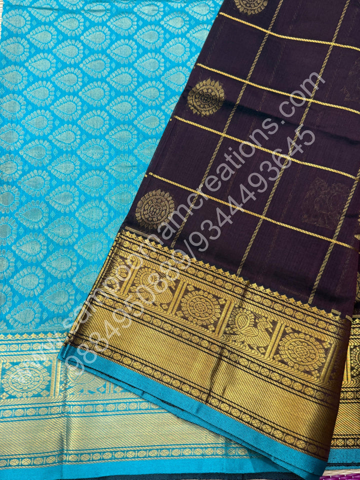 Cofee Brown with Turquoise Blue , Rich Mayil and Chakram butta in the body with Zari Checks , Traditional borders and Rich Pallu Pure Silk Cotton Saree